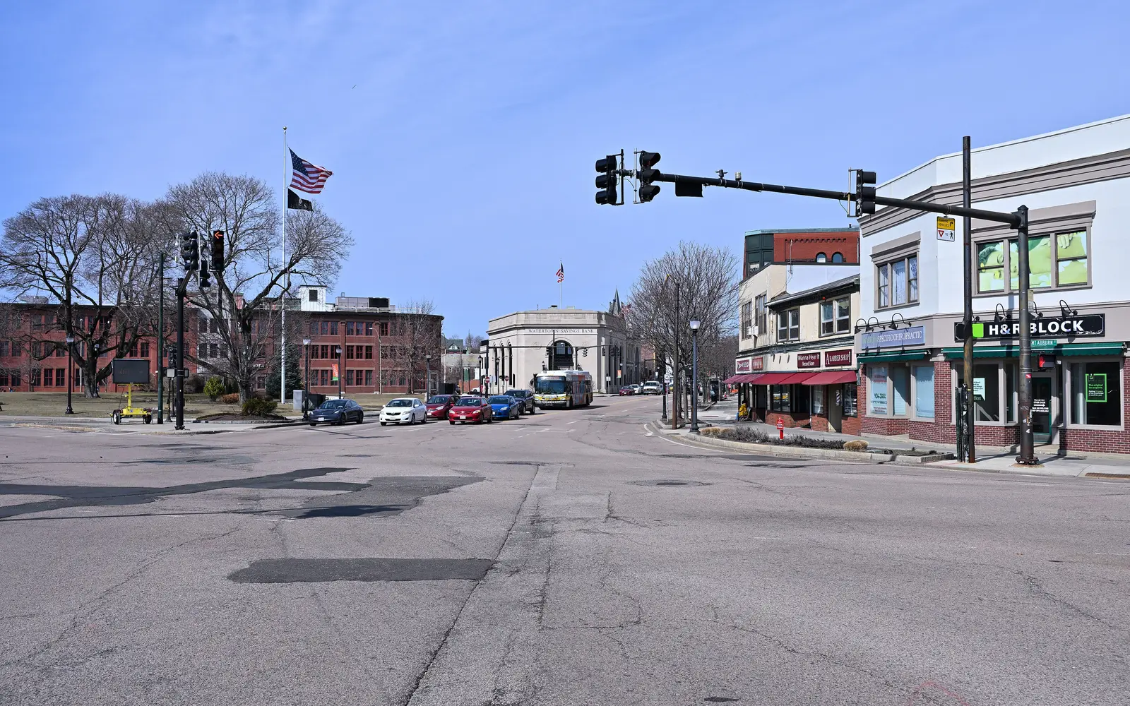 Storefronts and traffic signals at Watertown Square, looking west